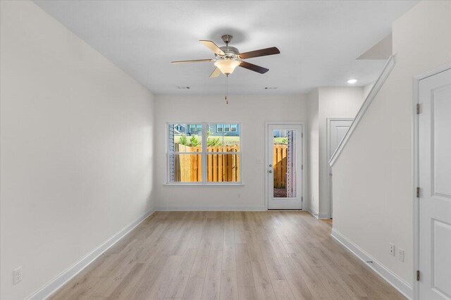 spare room with ceiling fan and light hardwood / wood-style flooring