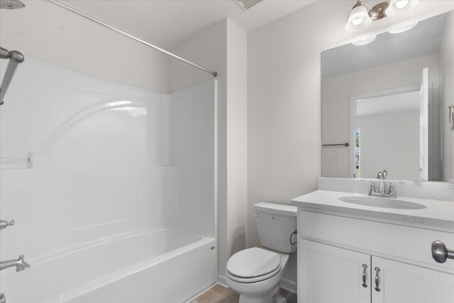 full bathroom with vanity, shower / bathing tub combination, and toilet