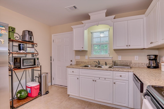 6005 Village W Ln, Graniteville, SC 29829 - kitchen featuring appliances with stainless steel finishes, white cabinets, light countertops, and light tile patterned flooring