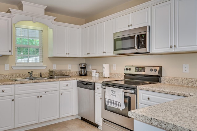 6005 Village W Ln, Graniteville, SC 29829 - kitchen with stainless steel appliances, white cabinetry, and light countertops