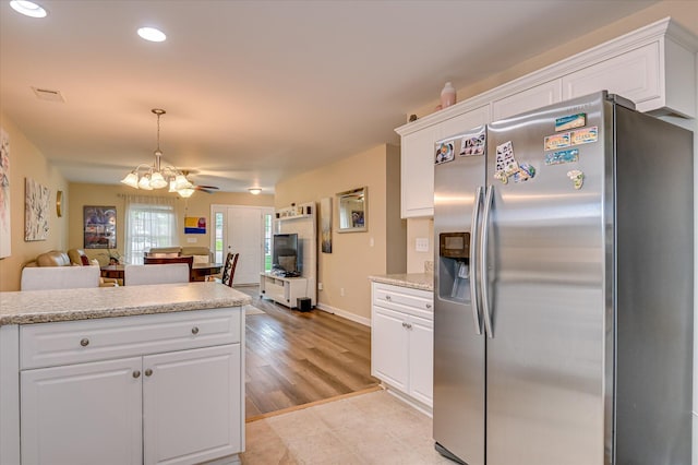 6005 Village W Ln, Graniteville, SC 29829 - kitchen with stainless steel fridge with ice dispenser, a chandelier, white cabinets, open floor plan, and recessed lighting