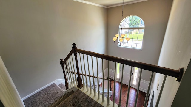 2806 Huntcliffe Dr, Augusta, GA 30909 - stairs featuring a chandelier, crown molding, and wood finished floors