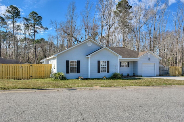 ranch-style house with roof with shingles, a front yard, fence, a garage, and driveway