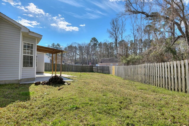 view of yard with a fenced backyard and a patio