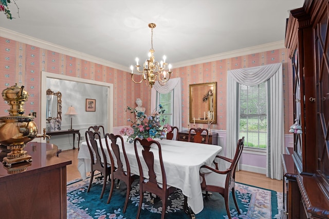 714 Jones Crk, Evans, GA 30809 - dining room featuring wallpapered walls, a chandelier, ornamental molding, wainscoting, and wood finished floors