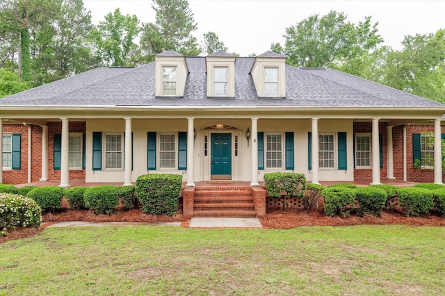714 Jones Crk, Evans, GA 30809 - view of front facade featuring a porch, a front lawn, and roof with shingles