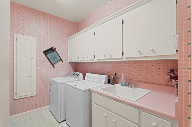 714 Jones Crk, Evans, GA 30809 - washroom with cabinet space, separate washer and dryer, baseboards, and wallpapered walls