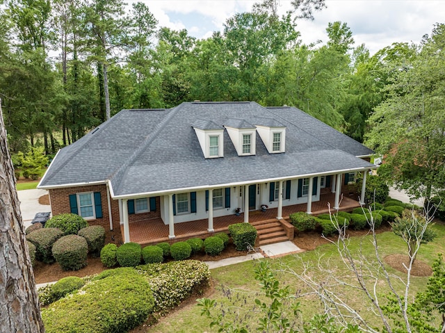 714 Jones Crk, Evans, GA 30809 - view of front of property with covered porch, a shingled roof, and brick siding