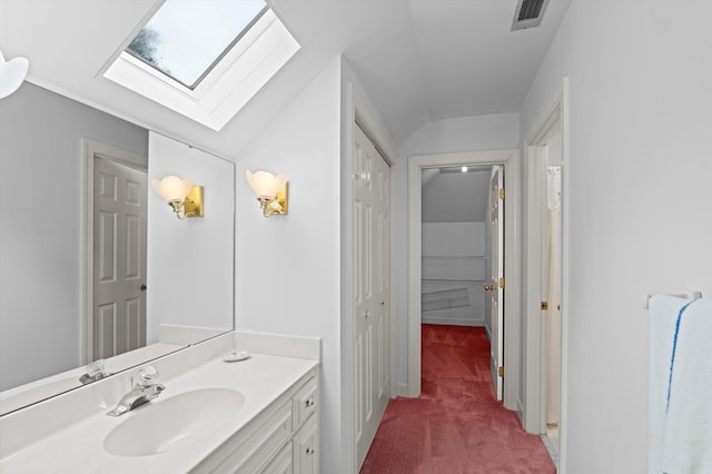 714 Jones Crk, Evans, GA 30809 - bathroom featuring a skylight, vanity, and a closet