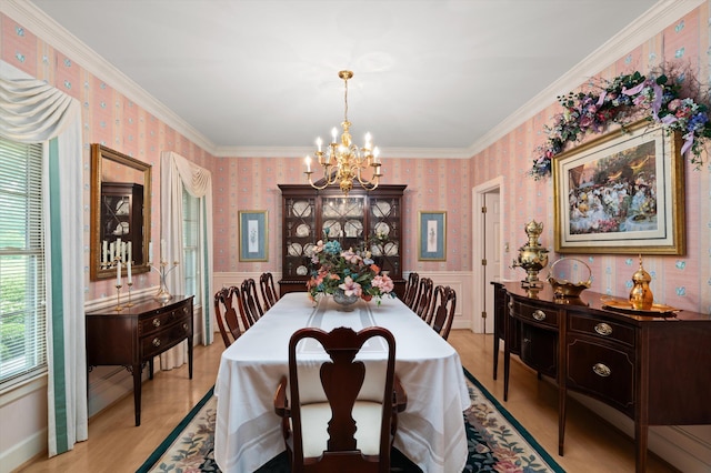 714 Jones Crk, Evans, GA 30809 - dining area featuring wallpapered walls, a chandelier, a wainscoted wall, ornamental molding, and light wood-style floors