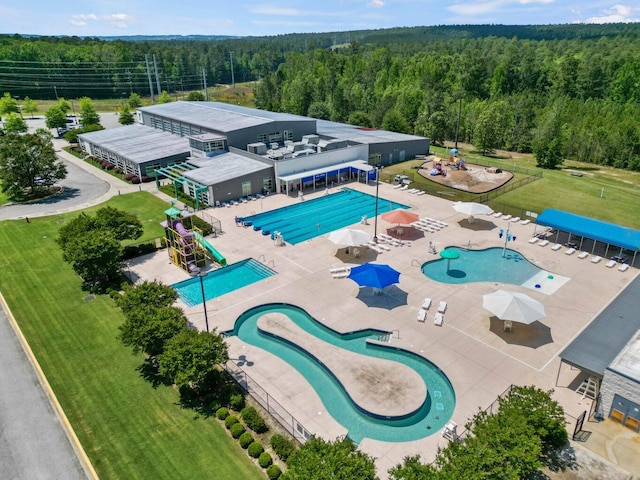 drone / aerial view featuring a forest view