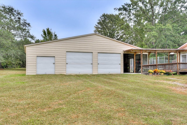 garage featuring a yard