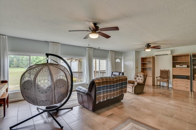 tiled living room with a textured ceiling, an AC wall unit, and ceiling fan