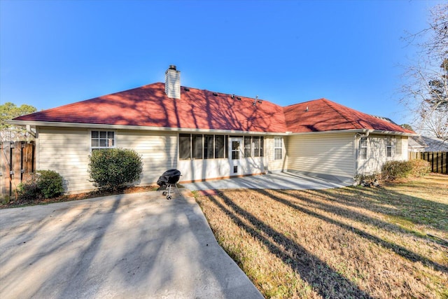 single story home featuring a patio area and a front yard