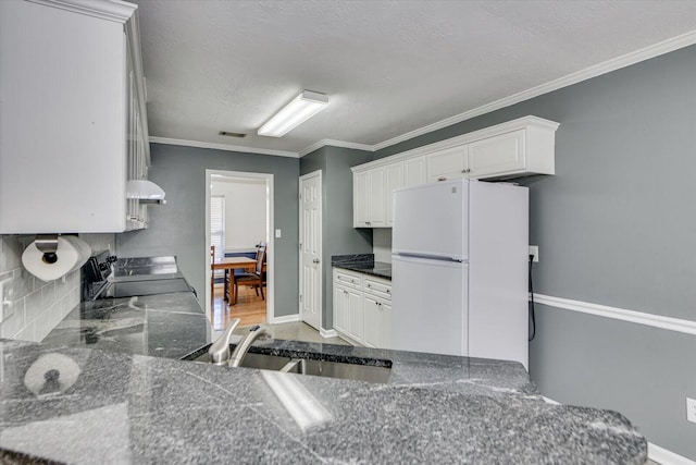 kitchen with sink, white cabinetry, white refrigerator, ornamental molding, and stove