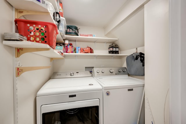 laundry room featuring washer and clothes dryer