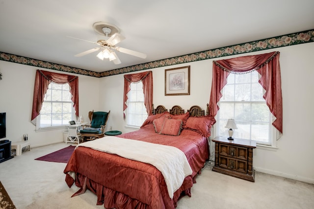 bedroom with light colored carpet and ceiling fan