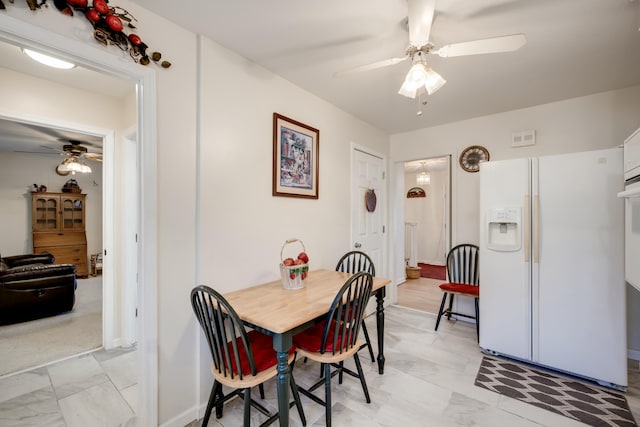 dining room with ceiling fan