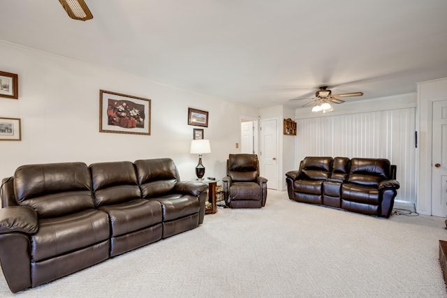 carpeted living room featuring ceiling fan