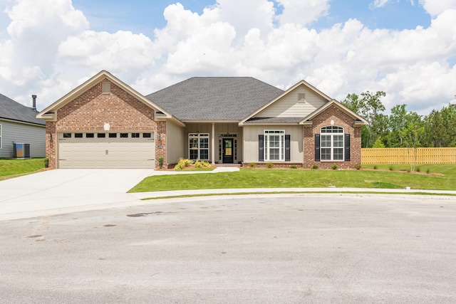 1216 Elbron Dr, Augusta, GA 30909 - craftsman house featuring brick siding, a garage, concrete driveway, and roof with shingles