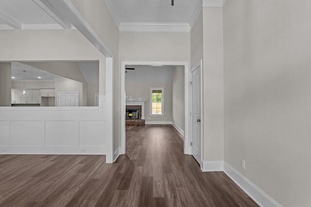 1216 Elbron Dr, Augusta, GA 30909 - foyer with dark wood-style flooring, crown molding, baseboards, and a brick fireplace