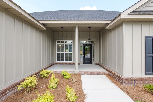 1216 Elbron Dr, Augusta, GA 30909 - doorway to property with board and batten siding, roof with shingles, and a porch
