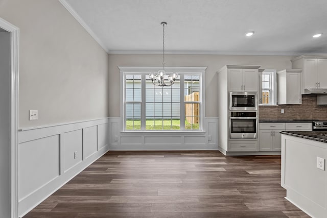 1216 Elbron Dr, Augusta, GA 30909 - kitchen featuring stainless steel oven, built in microwave, under cabinet range hood, ornamental molding, and a chandelier