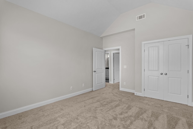 1216 Elbron Dr, Augusta, GA 30909 - unfurnished bedroom with carpet flooring, vaulted ceiling, baseboards, and a closet