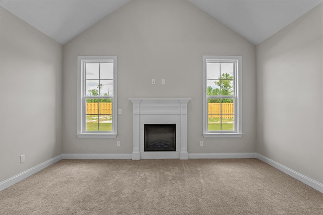 1216 Elbron Dr, Augusta, GA 30909 - unfurnished living room featuring healthy amount of natural light, carpet flooring, a fireplace, and high vaulted ceiling