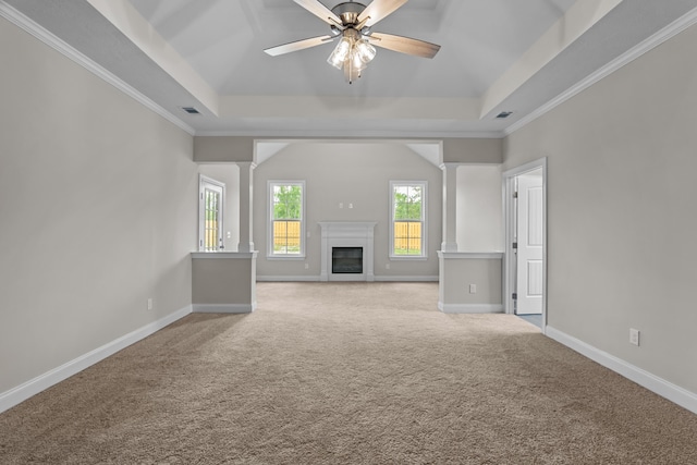 1216 Elbron Dr, Augusta, GA 30909 - unfurnished living room featuring a tray ceiling, ornate columns, carpet floors, a ceiling fan, and crown molding