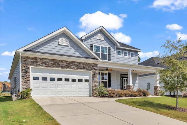 craftsman house featuring a porch, a garage, and a front lawn