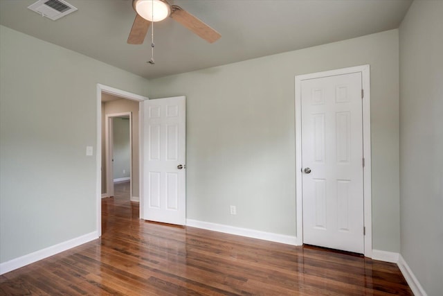 interior space featuring ceiling fan and dark wood-type flooring