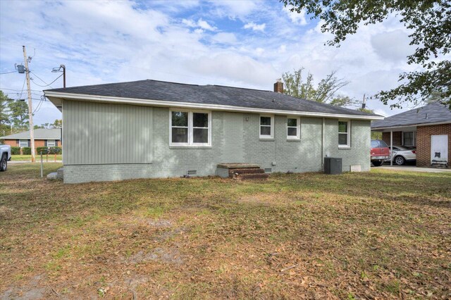 exterior space with a yard and central AC unit