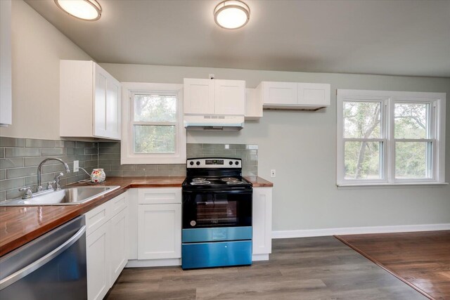 kitchen with sink, white cabinets, stainless steel appliances, and wooden counters