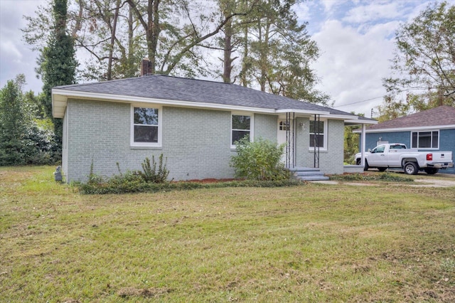 ranch-style house with a front yard