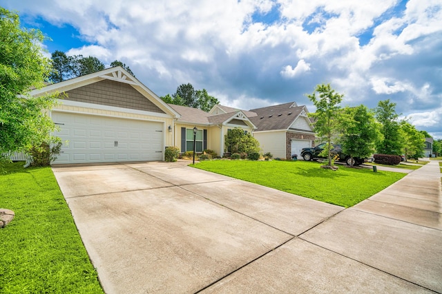 view of front of property with a garage and a front lawn