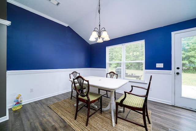 dining space with plenty of natural light, vaulted ceiling, dark wood-type flooring, and a chandelier