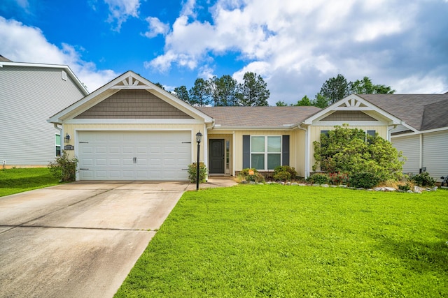 view of front of house featuring a front yard and a garage