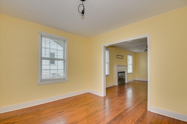 538 Hickman Rd, Augusta, GA 30904 - unfurnished living room featuring hardwood / wood-style floors and a fireplace with flush hearth