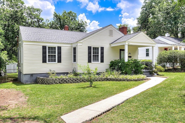 538 Hickman Rd, Augusta, GA 30904 - view of front of home with roof with shingles, a chimney, a front lawn, and covered porch