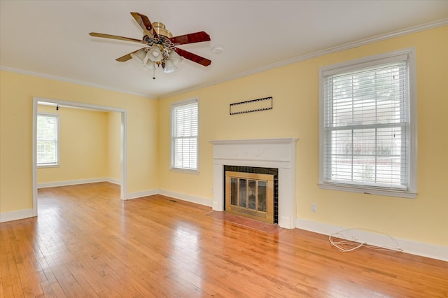 538 Hickman Rd, Augusta, GA 30904 - unfurnished living room featuring ceiling fan, light wood-style floors, crown molding, and a fireplace with flush hearth