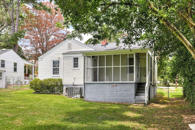 538 Hickman Rd, Augusta, GA 30904 - back of property with a sunroom, a chimney, and a shingled roof