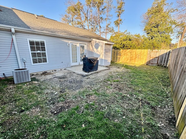 view of yard featuring central air condition unit