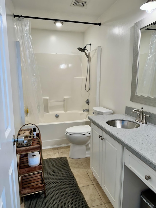 full bathroom with vanity, tile patterned floors, shower / bath combination with curtain, and toilet