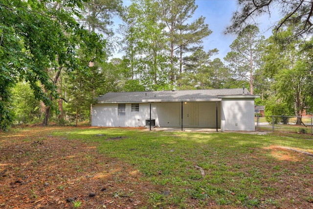 back of property featuring a patio, fence, a yard, and central air condition unit