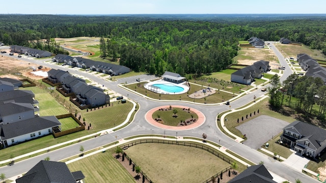 drone / aerial view featuring a forest view