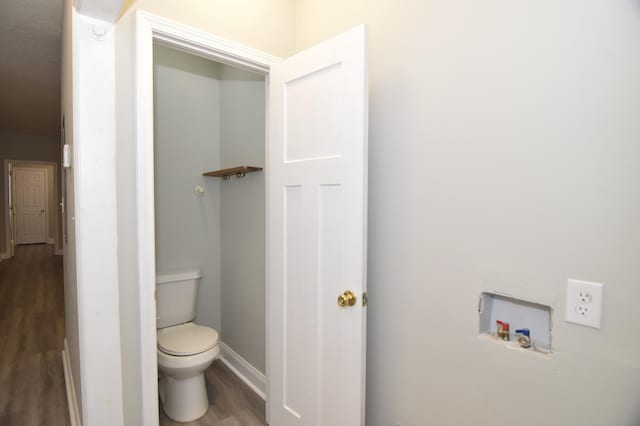 bathroom featuring toilet and hardwood / wood-style flooring