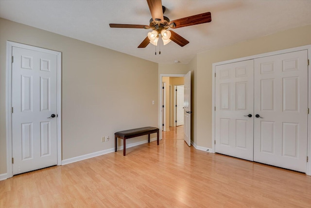 bedroom with ceiling fan and light hardwood / wood-style flooring