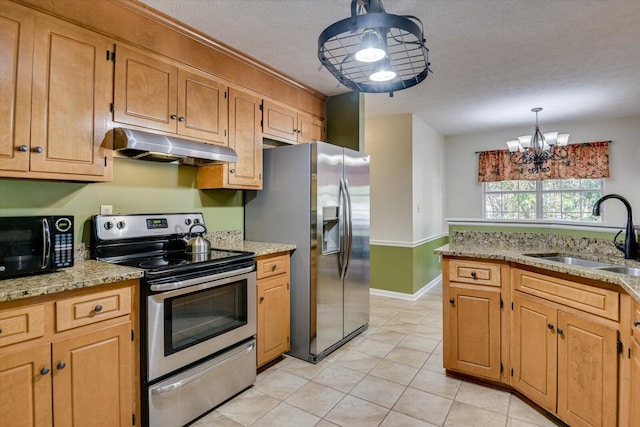 kitchen with a textured ceiling, stainless steel appliances, sink, an inviting chandelier, and hanging light fixtures