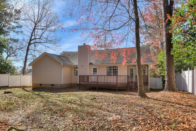 back of house with a deck